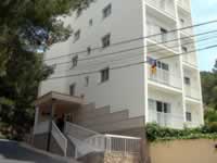 Some of the El Pinar Apartments are across a road