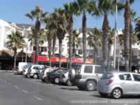 Benalmadena Tourist Bus, behind the palm trees