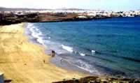 Playa Blanca beach with Puerto Rosario in the right background