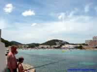 Young boy fishing at in front of the Cala Llonga Fiesta Hotel