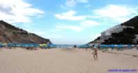 The sheltered Cala Llonga bay & beach. Cala Llonga hotel on the right. 