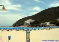 Beach with Cala Llonga hotel & Aparthotel El Pinar in background 