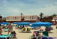 Cala Llonga Beach with shops & bars in Background 