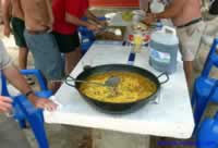 Preparing a Meal in front of the boat houses