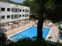 El Pinar Apartments pool and fir tree