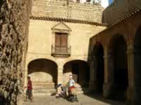 Day view of Gate Portal de ses Taules courtyard Placa d' armes